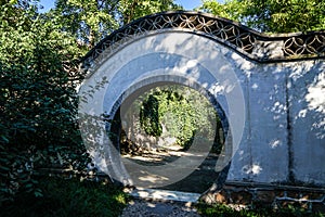 Historic traditional Chinese moon gate of Beijing at sunny day in summer