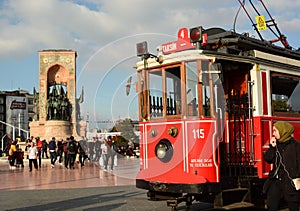 A historic tram on Taksim square. Beyoglu. Istanbul. Turkey