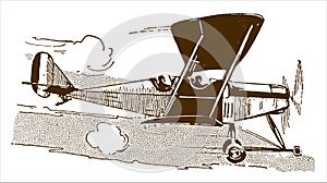 Historic two-seater biplane flying in front of a cloudy sky