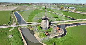 Historic vintage windmill in The Netherlands, typical dutch sight.