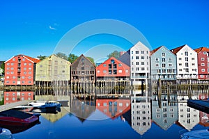 Historic warehouses on stilts from Trondheim with spectacular reflection