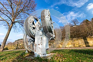 Historic water pump with gears on the Glan promenade in Meisenheim