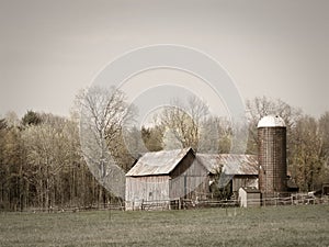 Historic weathered old wood barn and pasture in FingerLakes