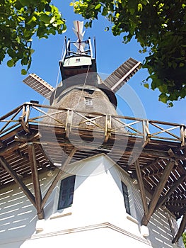 Historic windmill in front of blue sky