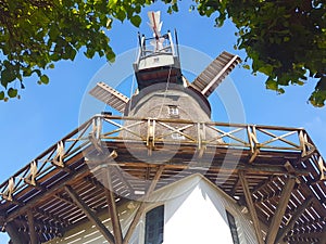 Historic windmill in front of blue sky
