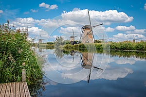 The historic windmills of Kinderdijk reflecting in the canal, Netherlands.