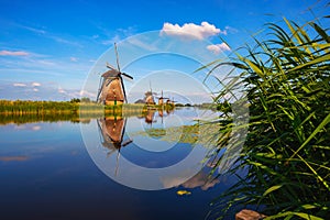 Historic windmills and a river flowing by in Kinderdijk, Netherlands