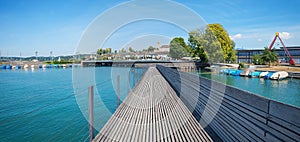 Historic wooden bridge from Hurden to Rapperswil, lake zurichsee and obersee, turquoise water