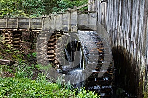 Historic wooden gristmill with working waterwheel