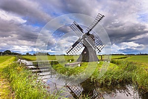Historic Wooden Windmill photo