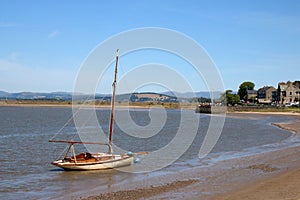 Historic yacht by beach on River Kent, Arnside.