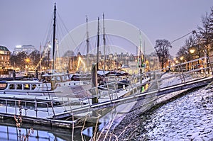 Historic yachts in a marina in winter