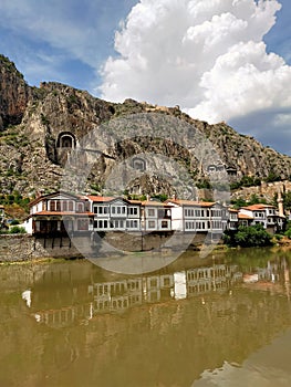 Historical Amasya houses on the banks of the KÄ±zÄ±lÄ±rmak River and Kralkaya  King rock tombs cemeteries on the back.