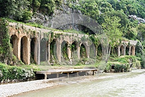 Historical 17-arches Roman aqueduct in Nahr el Kalb, Lebanon photo