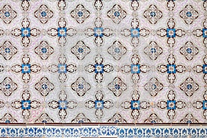 Historical azulejos tiles, facade decoration portugal. beautiful floral ornament pattern, blue brown and light pink