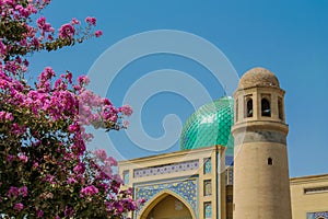 Historical beautiful mausoleum monument decorated with rose flowers in Tajikistan