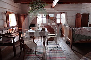 Historical bedroom of richer peasant, reeve or mayor from 19th century in northern Slovakia, with hanged christmas tree photo