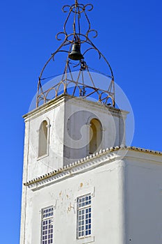 The historical bell tower of Torre de Relogio in Albufeira old town photo