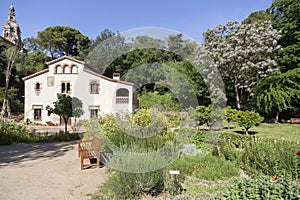 Historical botanical garden with masia, typical catalan rural h