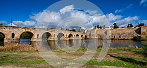 Puente Romano, the Roman Bridge in Merida with the Alcazaba, Extremadura, Spain photo