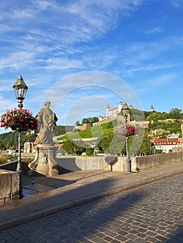 Historical bridge with statue at a sunny day in würzburg