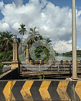 Historical bridge in the Udupi with Indian lion pillar and beautiful sky