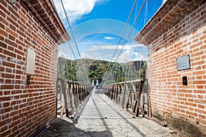 The historical Bridge of the West a a suspension bridge declared Colombian National Monument built in 1887 over the Cauca River