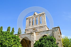 Historical building in Cypriot Bellapais Abbey complex in city Bellapais, Turkish Northern Cyprus taken from below with blue sky