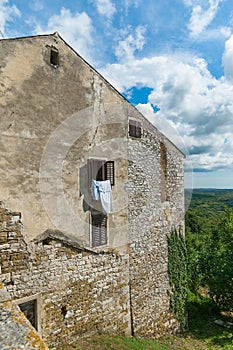 Historical building from stone in the old town of Buje. Istria, Croatia