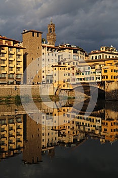 Historical buildings reflected in the Arno river in Florence, It