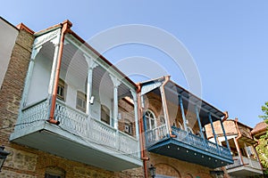 Historical buildings in Sighnaghi, Kakheti, Georgia. Traditional Georgian houses with wooden balconies painted in pastel