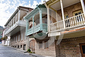 Historical buildings in Sighnaghi, Kakheti, Georgia. Traditional Georgian houses with wooden balconies painted in pastel