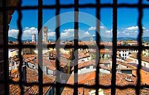 Historical centre of medieval town Lucca with old buildings, typical orange terracotta tiled roofs