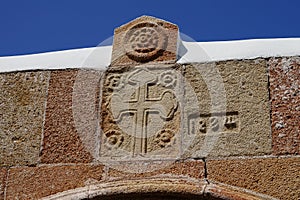 Historical decor adorns the outer wall of St. Mary\'s Church in Lindos. Rhodes Island, Dodecanese