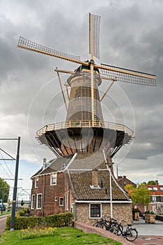 Historical dutch windmill in the city of Delft known locally as De Roos (the rose)