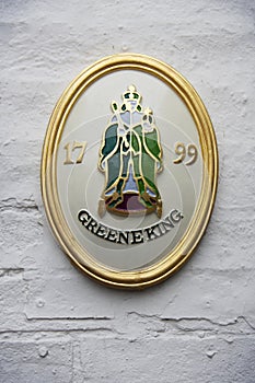 A historical emblem of Greene King brewery