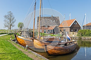 Historical fishing vessels anchored in harbor Dutch fishing village Workum