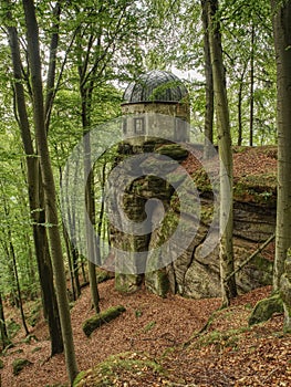 Historical gazebo with reneval cupola roof stands on rock i