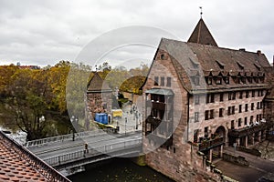 Historical Heilig-Geist-Spital Holy Spirit Hospital near Pegnitz river in the old town of Nuremberg, Bavaria, Germany