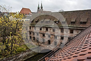 Historical Heilig-Geist-Spital Holy Spirit Hospital near Pegnitz river in the old town of Nuremberg, Bavaria, Germany