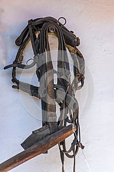 Historical horse harness hanging on the wall