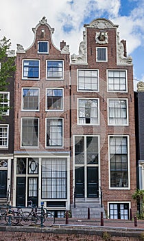 Historical houses at a canal in Amsterdam