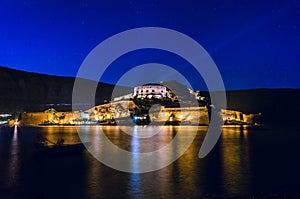 The historical island of Spinalonga illuminated