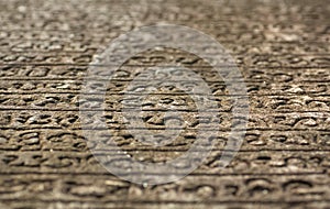 Historical manuscript on stone. Sinhalese language on 12th century wall of Hindu temple. Polonnaruwa, Sri Lanka.