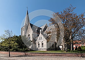 Side view of the gothic parish church in the city centre of Heist-op-den-Berg, Belgium photo