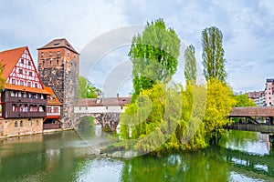 Historical old town with view of Weinstadel, bridge and Henkerturm tower in Nurnberg, Germany