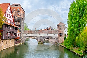 Historical old town with view of Weinstadel, bridge and Henkerturm tower in Nurnberg, Germany