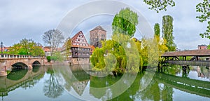Historical old town with view of Weinstadel, bridge and Henkerturm tower in Nurnberg, Germany