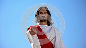 Historical personification of Jesus Christ reaching arm to camera, helping hand