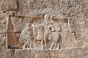 Historical relief carved between 239 - 70 AD about triumph of king Shapur I the Great